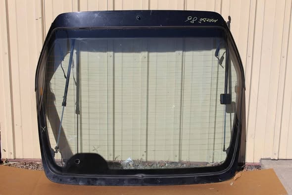 Mazda RX-7 FC rear glass, 1986–1991 RX-7 hatch, OEM Mazda rear window, FC RX-7 coupe parts, replacement hatch glass, RX-7 restoration parts, genuine Mazda FC glass, hard-to-find RX-7 OEM parts