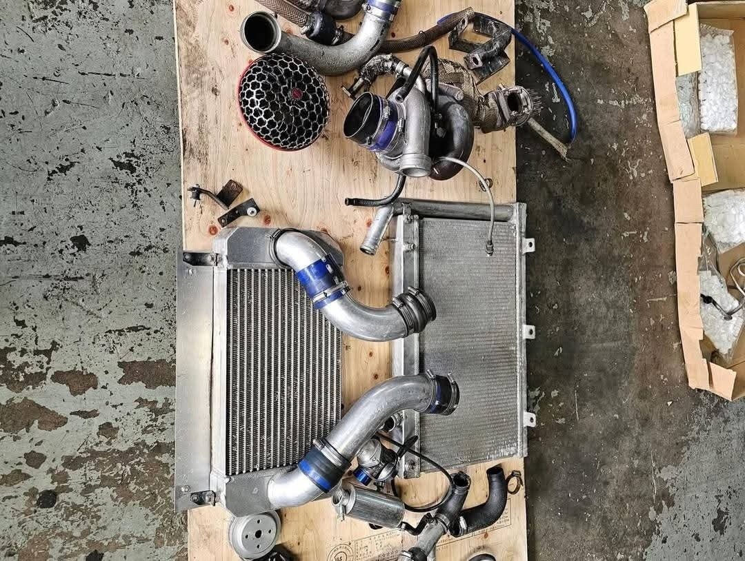 Mazda RX7 FD3S turbo kit, Knightsport intercooler, GCG T04S turbo, Greddy BOV, RX7 FD turbo setup, 13B rotary turbo kit, RX7 performance parts, RX7 FD3S aftermarket turbo, rotary engine upgrade, RX7 turbo upgrade kit.